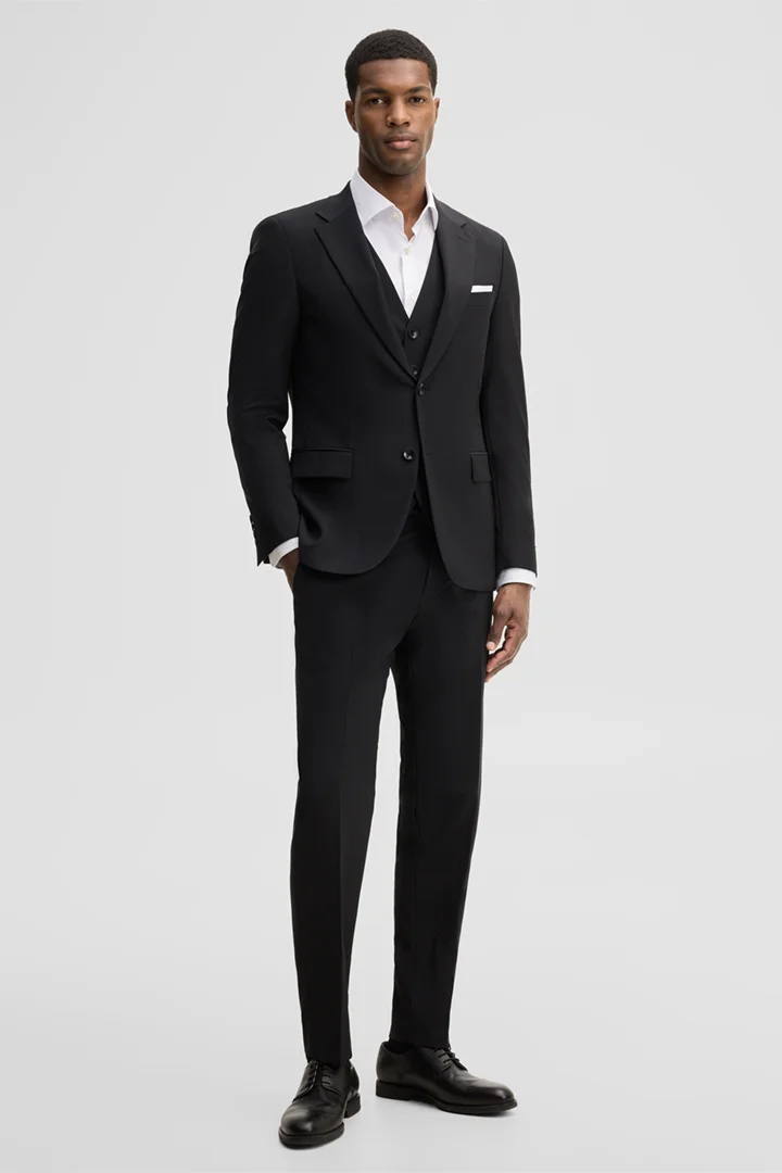Leads to product detail page "Modular trousers in a wool blend, black"