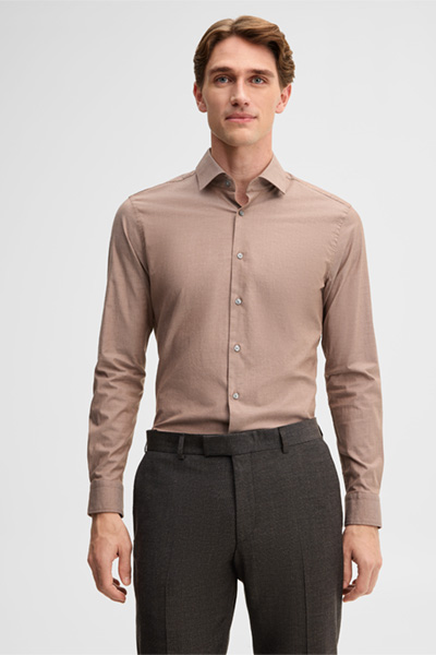 Leads to product detail page "Stretch shirt with a Kent collar, beige"