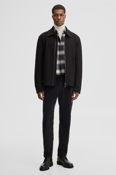 Leads to product detail page "Stretch corduroy chinos, black"