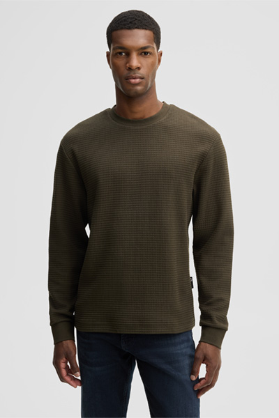 Leads to product detail page "Round-neck jumper, olive"