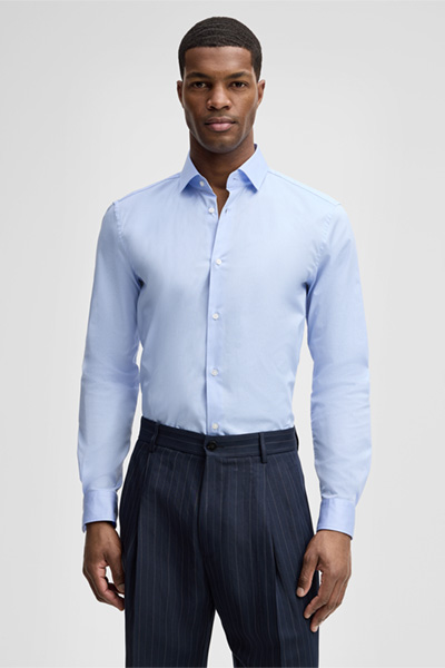 Leads to product detail page "Stan Shirt in Light Blue"