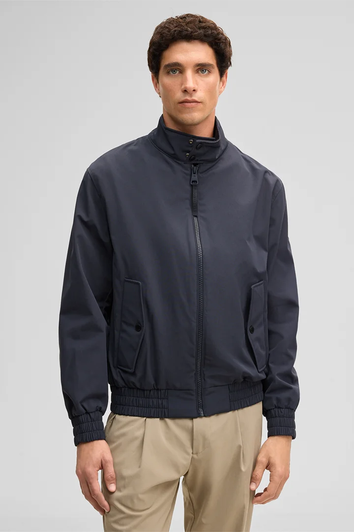 Leads to product detail page "Jacket, navy"