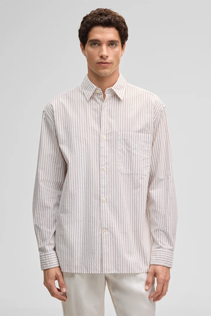 Leads to product detail page "Charly Shirt in White/Pink Stripes"