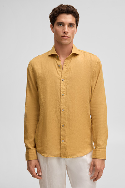 Leads to product detail page "Ceasar shirt, mustard yellow"