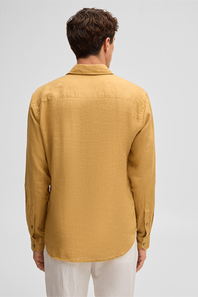 Leads to product detail page "Ceasar shirt, mustard yellow"