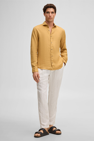 Leads to product detail page "Ceasar shirt, mustard yellow"
