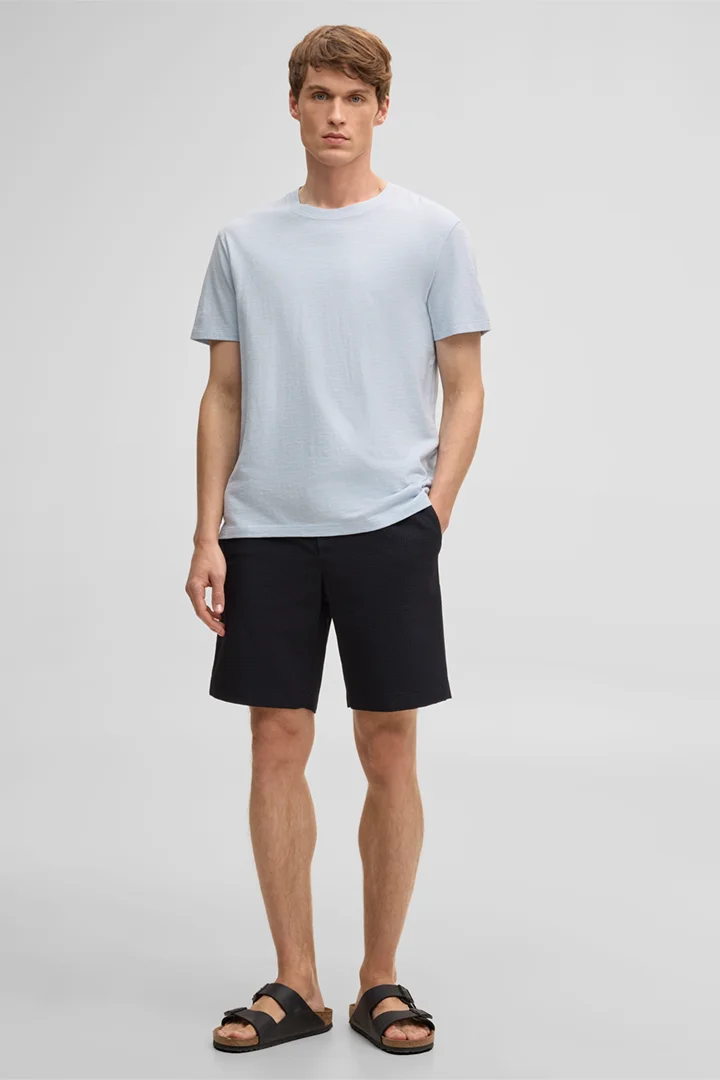 Leads to product detail page "Kaji Shorts in Navy"